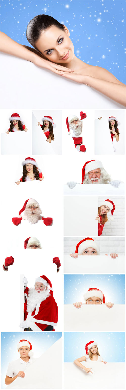 People in santa costumes holding posters stock photo
